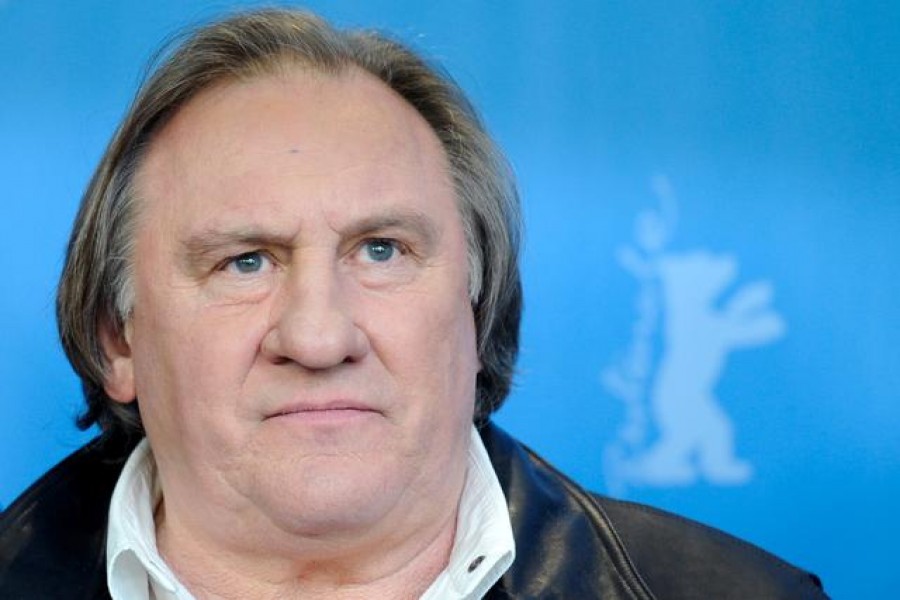FILE PHOTO: Actor Gerard Depardieu poses during a photocall to promote the movie 'Saint Amour' at the 66th Berlinale International Film Festival in Berlin, Germany February 19, 2016. REUTERS/Stefanie Loos/File Photo