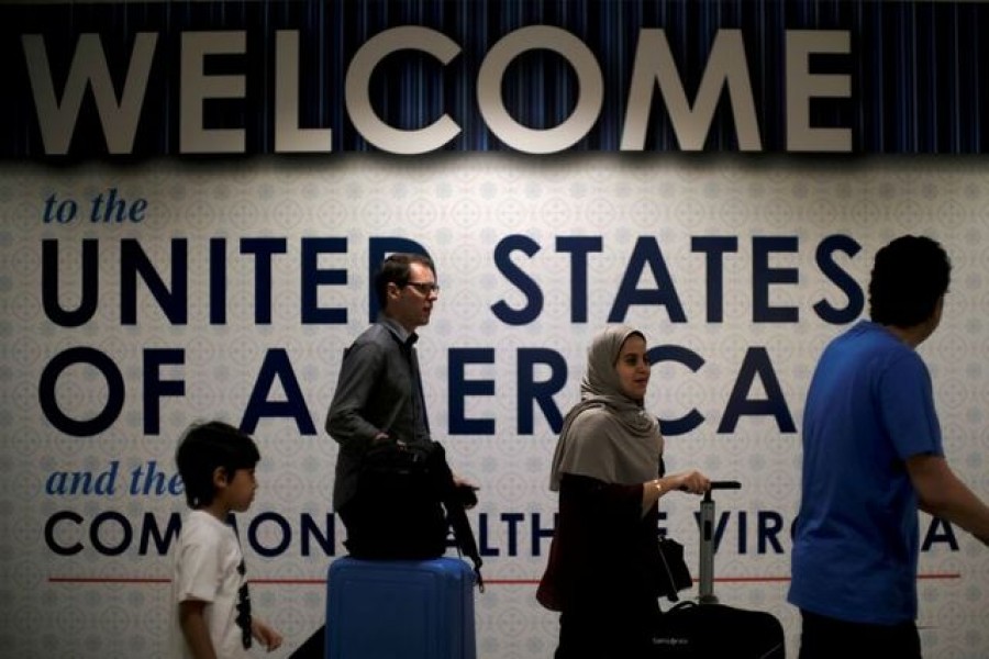 International passengers arrive at Washington Dulles International Airport after the US Supreme Court granted parts of the Trump administration's emergency request to put its travel ban into effect later in the week pending further judicial review, in Dulles, Virginia, US, June 26, 2017. REUTERS/James Lawler Duggan