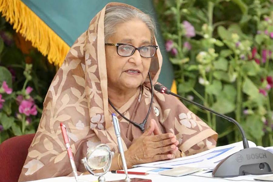 Prime Minister Sheikh Hasina presiding over the National Economic Council (NEC) meeting held at the NEC conference room through a videoconference from Ganabhaban on Tuesday -PID Photo