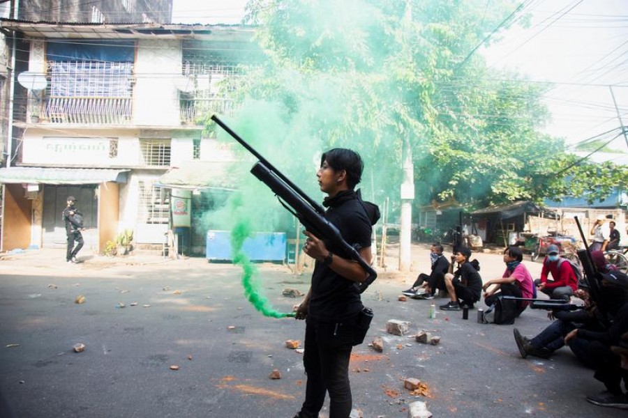 A protester holds a homemade pipe air gun during a protest against the military coup in Yangon, Myanmar April 3, 2021. REUTERS/Stringer