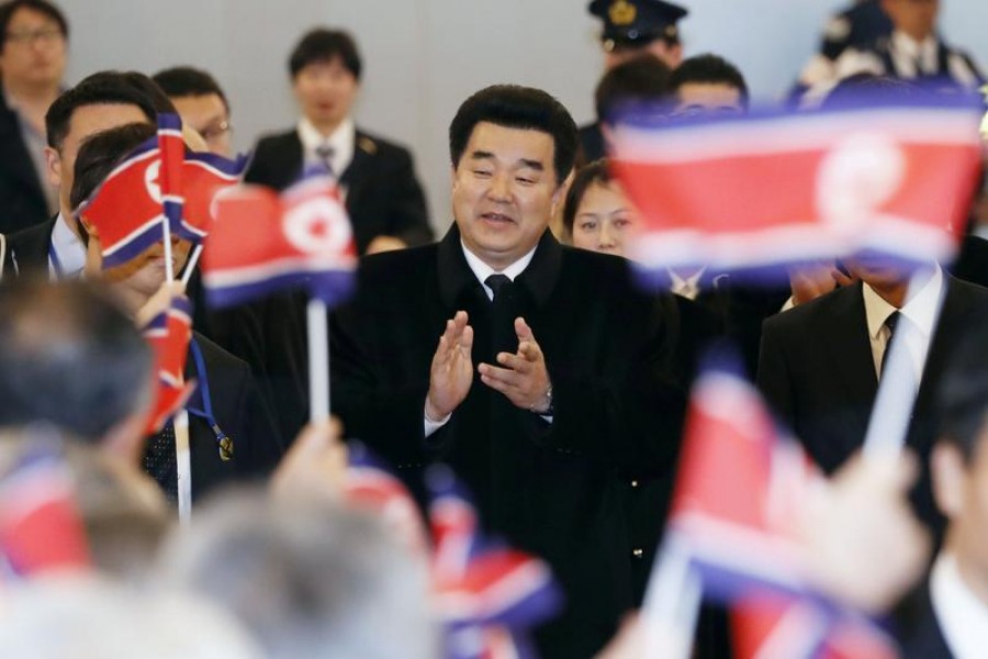 FILE PHOTO: Kim Il Guk, North Korea's sports minister and the president of the Olympic Committee of North Korea is greeted by North Korean residents in Japan upon his arrival at Tokyo's Haneda airport in Japan, in this photo taken by Kyodo November 27, 2018. Mandatory credit Kyodo/via REUTERS