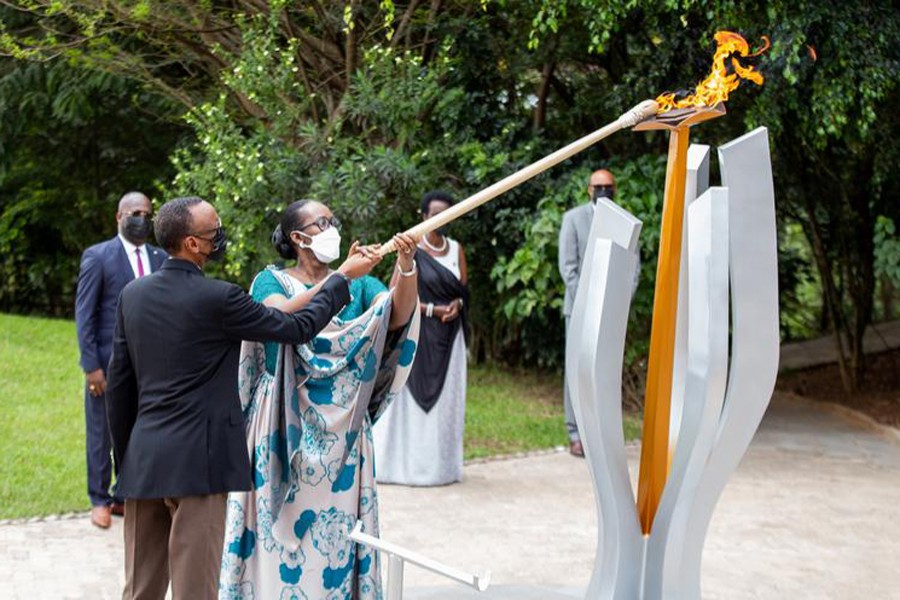 Rwanda President Paul Kagame and first lady Jeanette Kagame light the Rwandan genocide flame of hope, known as the "Kwibuka" (Remembering), to commemorate the 1994 Genocide, at the Kigali Genocide Memorial Center in Kigali, Rwanda on April 7, 2021 — Reuters photo