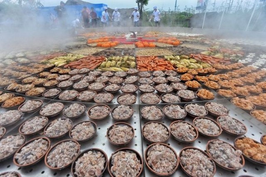 Steamed dishes are seen on a giant food steamer for an event at a tourist attraction in Xiantao, Hubei province, China April 26, 2019 — Reuters/Stringer/Files