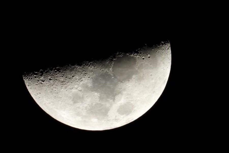 Moon is seen in the sky during the closest visible conjunction of Jupiter and Saturn in 400 years, in Tejeda, on the island of Gran Canaria, Spain December 21, 2020. REUTERS/Borja Suarez