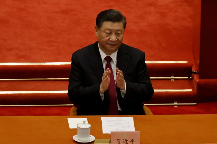 Chinese President Xi Jinping applauds at the closing session of the Chinese People's Political Consultative Conference (CPPCC) at the Great Hall of the People in Beijing, China March 10, 2021. REUTERS/Carlos Garcia Rawlins