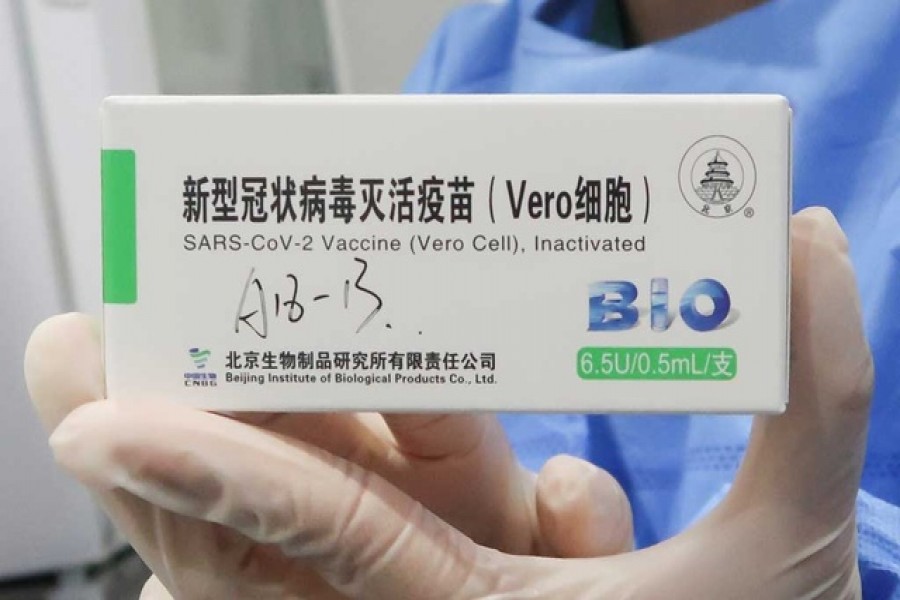 A nurse holds a box of the coronavirus disease (COVID-19) vaccine made by the Beijing Institute of Biological Products, a unit of Sinopharm subsidiary China National Biotec Group (CNBG), at a vaccination centre during a government-organised visit, in Beijing, China, Apr 15, 2021. REUTERS