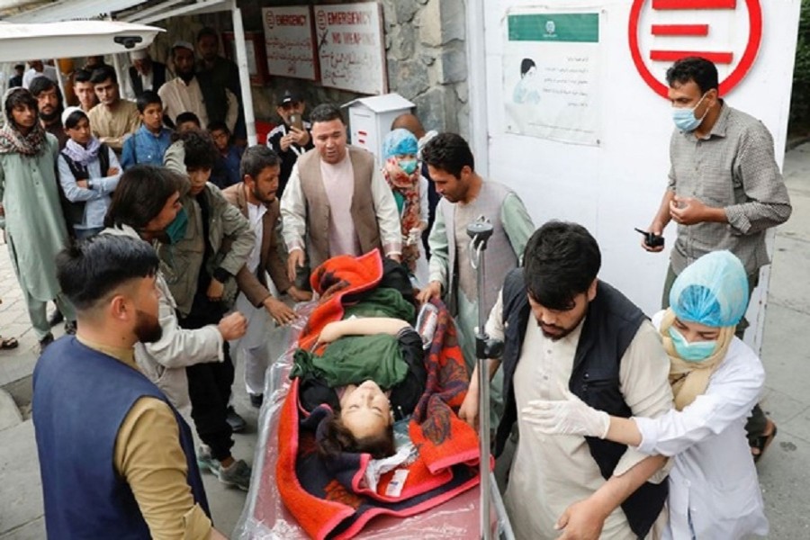 A woman being taken to a hospital following a bombing in Kabul on Saturday. Reuters