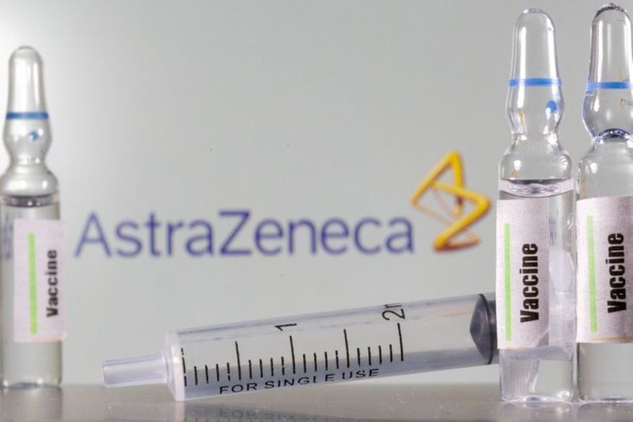 A test tube labelled "vaccine" in front of an AstraZeneca logo in this illustration taken on September 9, 2020 — Reuters/Files