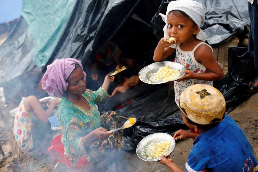 Rohingya refugees seen having their breakfast in Kutupalong Makeshift Refugee Camp in Cox's Bazar — Reuters file photo used only for representation