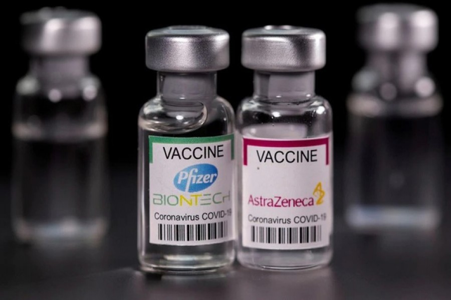 Vials with Pfizer-BioNTech and AstraZeneca COVID-19 vaccine labels are seen in this illustration picture taken March 19, 2021 - Reuters photo