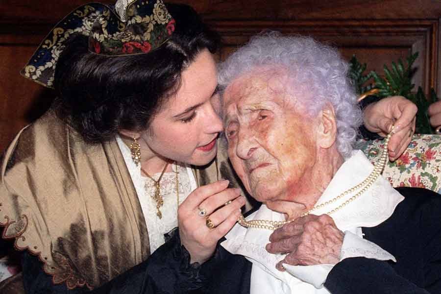 Jeanne Calment celebrates her 121st birthday with a kiss from Catherine Sautecoeur in Arles, France, on February 21 1996.