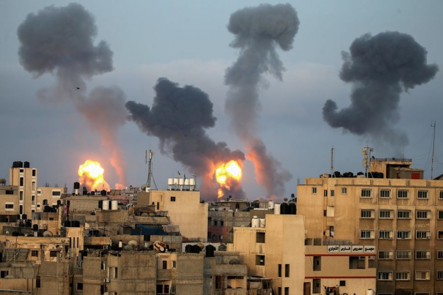 Representational image: Flames and smoke rise during Israeli air strikes amid a flare-up of Israel-Palestinian violence, in the southern Gaza Strip May 11, 2021 — Reuters/Ibraheem Abu Mustafa