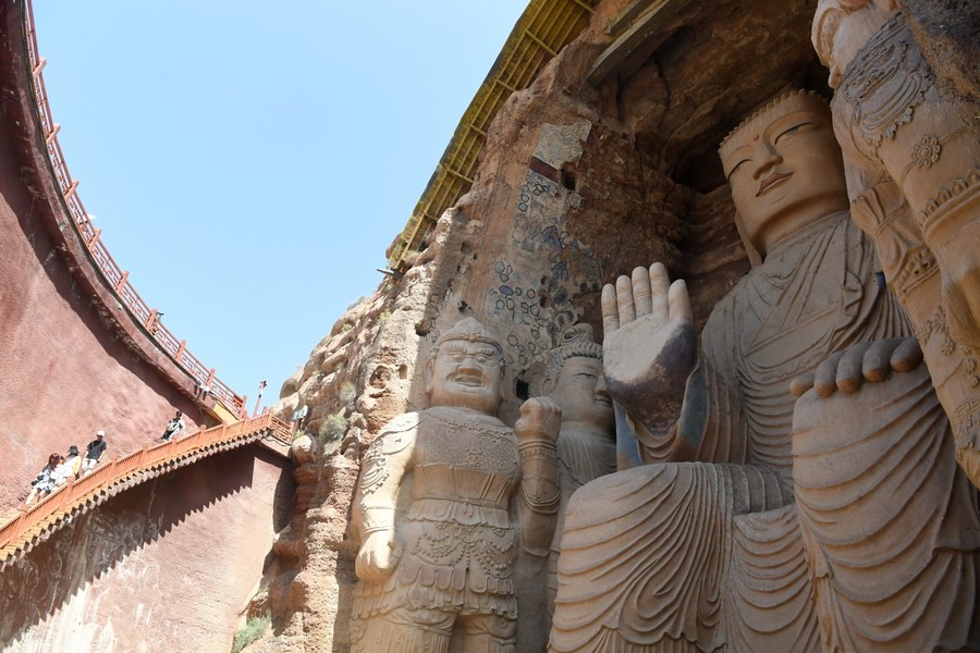 1,600-yr-old Buddha statue's feet restored in northwest China