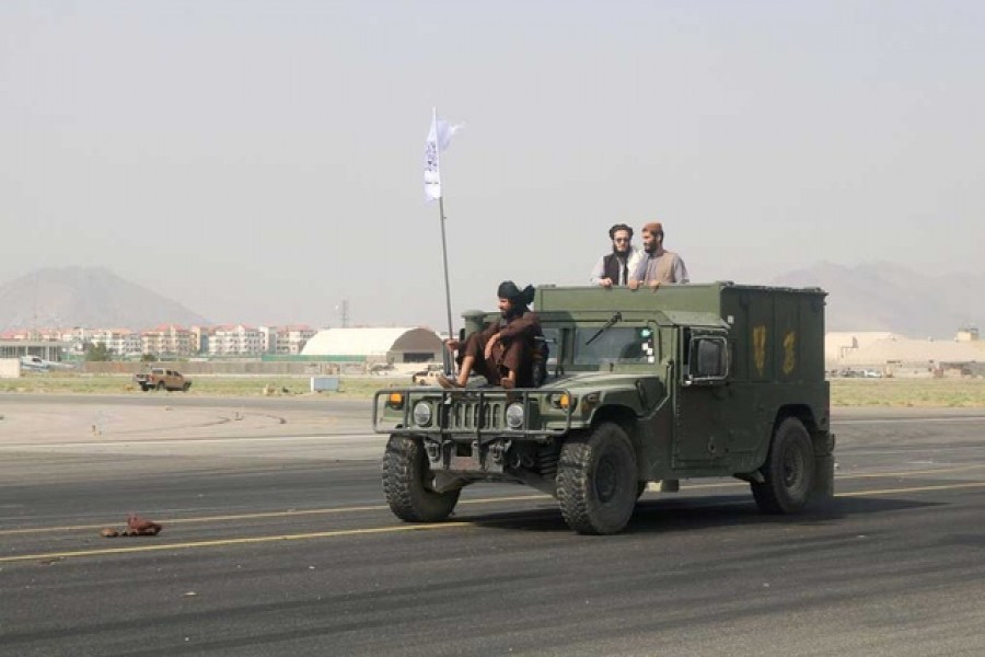 aliban forces patrol at a runway a day after the US troops withdrawal from Hamid Karzai International Airport in Kabul, Afghanistan August 31, 2021. REUTERS/Stringer