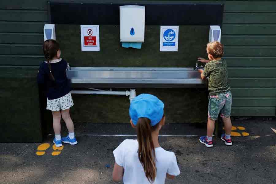Children washing their hands at Heath Mount School at Watton-at-Stone in Britain as some schools reopen following the outbreak of the COVID-19 last year -Reuters file photo