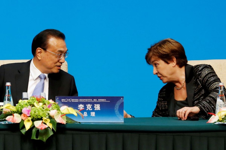 International Monetary Fund (IMF) Managing Director Kristalina Georgieva talks to Chinese Premier Li Keqiang before a news conference following the "1+6" Roundtable meeting at the Diaoyutai state guesthouse in Beijing, China November 21, 2019 — Reuters/ Florence Lo