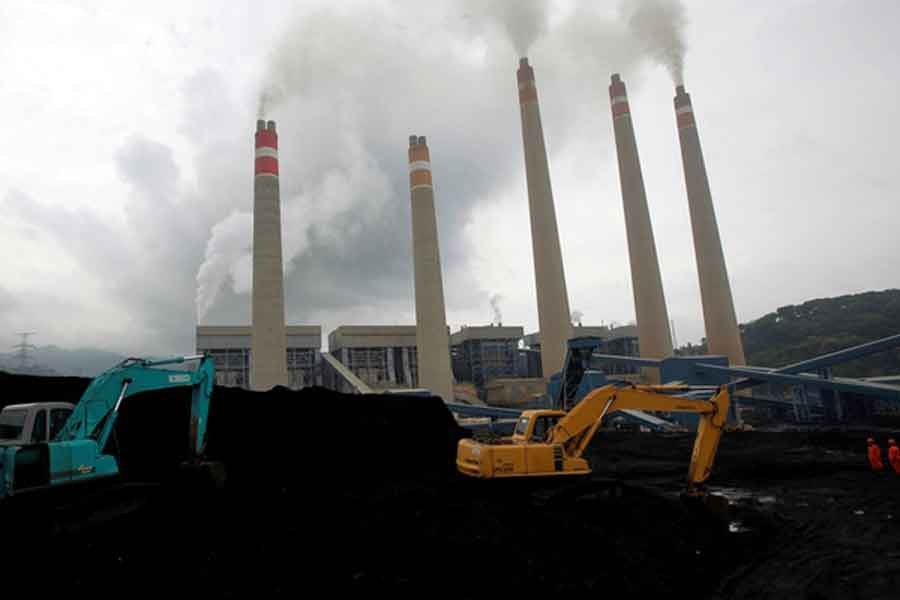 Excavators piling coal in a storage area in an Indonesian Power Plant  -Reuters file photo