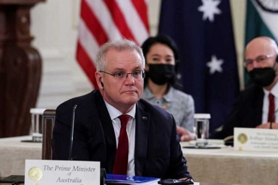 Australia's Prime Minister Scott Morrison is seated with members of his delegation as he participates in a 'Quad nations' meeting at the Leaders' Summit of the Quadrilateral Framework hosted by US President Joe Biden in the East Room at the White House in Washington, US, September 24, 2021. REUTERS/Evelyn Hockstein