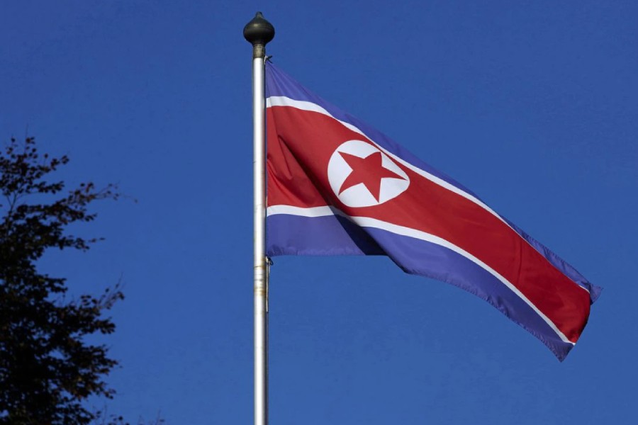 A North Korean flag flies on a mast at the Permanent Mission of North Korea in Geneva October 2, 2014. REUTERS/Denis Balibouse/File Photo