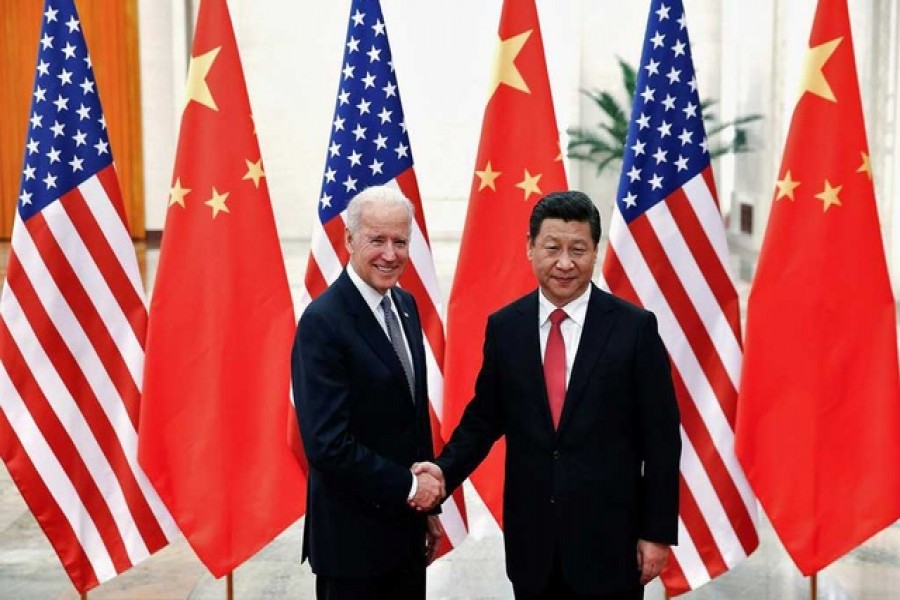 Chinese President Xi Jinping shakes hands with US Vice President Joe Biden (L) inside the Great Hall of the People in Beijing, December 4, 2013 -- Reuters/Lintao Zhang/Pool//File Photo