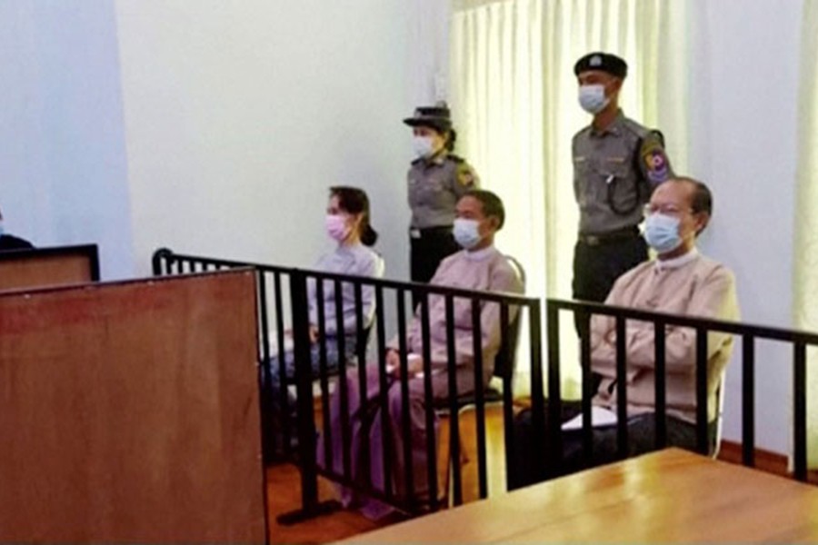 Myanmar's ousted leader Aung San Suu Kyi, former president Win Myint and doctor Myo Aung appear at a court in Naypyitaw, Myanmar May 24, 2021, in this still image taken from video. MRTV/REUTERS TV