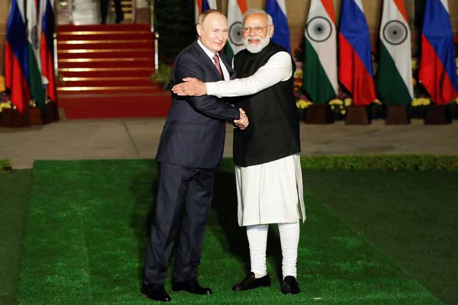 Russia's President Vladimir Putin shaking hands with India's Prime Minister Narendra Modi ahead of their meeting at Hyderabad House in New Delhi on Monday -PID Photo