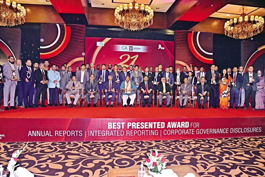 Recipients of the '21st ICAB National Award for best presented Annual Reports in 2020' pose with Commerce Minister Tipu Munshi at the award giving ceremony organised by the Institute of Chartered Accountants of Bangladesh (ICAB) at a city hotel on Saturday