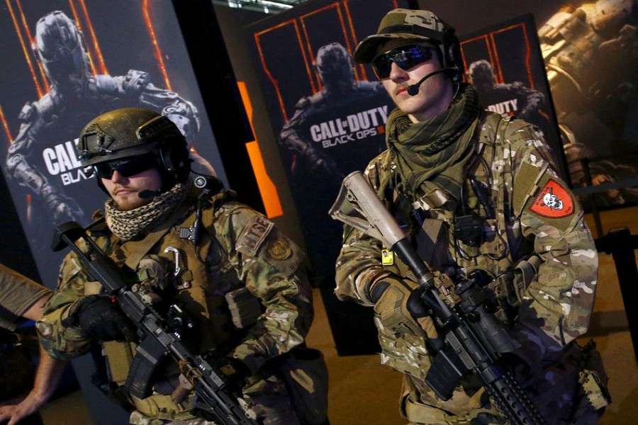 FILE PHOTO: Men are dressed as soldiers to promote the video game "Call Of Duty Black Ops 3" at the Gamescom fair in Cologne, Germany August 05, 2015. REUTERS/Kai Pfaffenbach