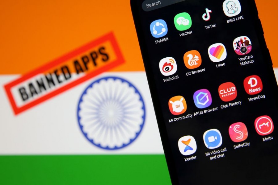Smartphone with Chinese applications is seen in front of a displayed Indian flag and a "Banned app" sign in this illustration picture taken July 2, 2020. REUTERS/Dado Ruvic/Illustration
