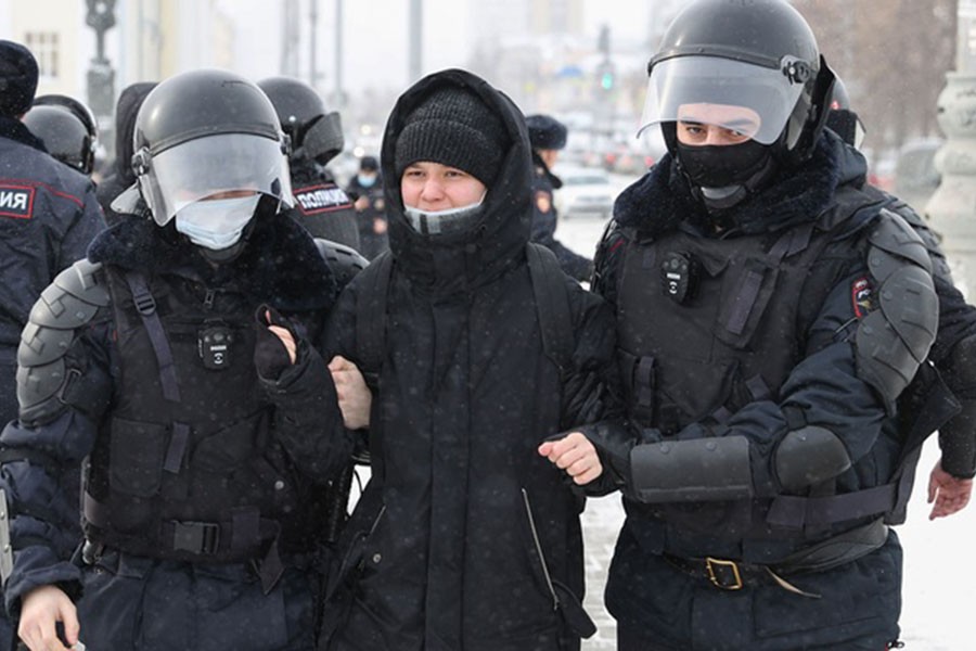 Russian officers detain a protester at the Labour Square during an unsanctioned protest against the special military operation announced by President Putin in Ukraine. Donat Sorokin/TASS VIA REUTERS