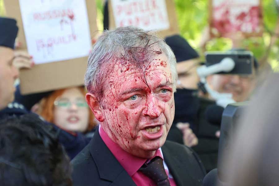 Russia's ambassador to Poland Sergey Andreev is covered in red substance thrown by protesters in Warsaw on Monday as he came to celebrate Victory day at the Soviet Military Cemetery to mark the 77th anniversary of the victory over Nazi Germany –Reuters file photo