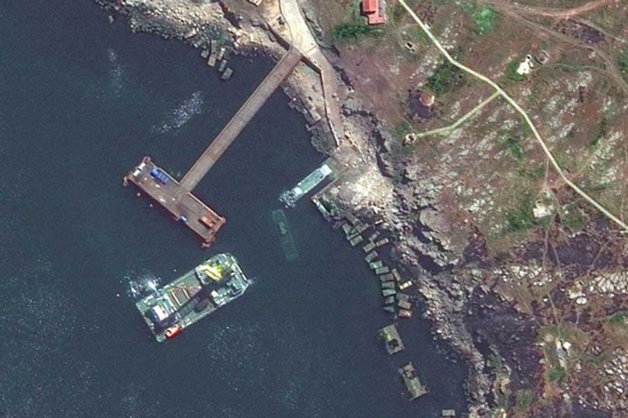 A satellite image shows a closer view of a barge, a Serna-class landing craft and a sunken Serna craft in Snake Island, Ukraine May 12, 2022. Satellite image 2022 Maxar Technologies/REUTERS