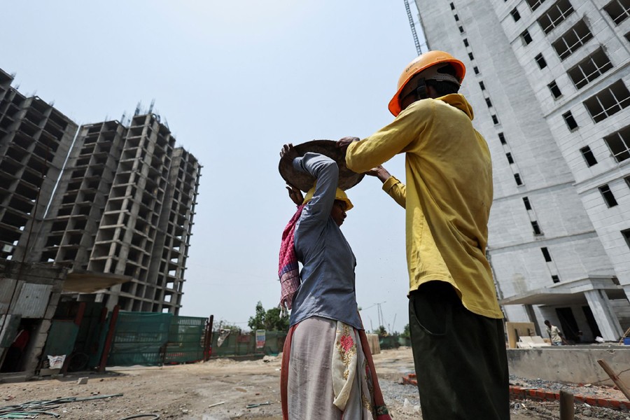 Labourers work at a construction site on a hot summer day in Noida, India on May 12, 2022 — Reuters photo