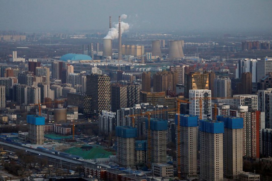 Residential buildings under construction and a power station are seen near the central business district (CBD) in Beijing, China, January 15, 2021. (Reuters)