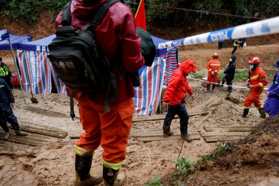 Rescue workers work at the site where a China Eastern Airlines Boeing 737-800 plane flying from Kunming to Guangzhou crashed, in Wuzhou, Guangxi Zhuang Autonomous Region, China March 24, 2022. REUTERS/Carlos Garcia Rawlins/File Photo