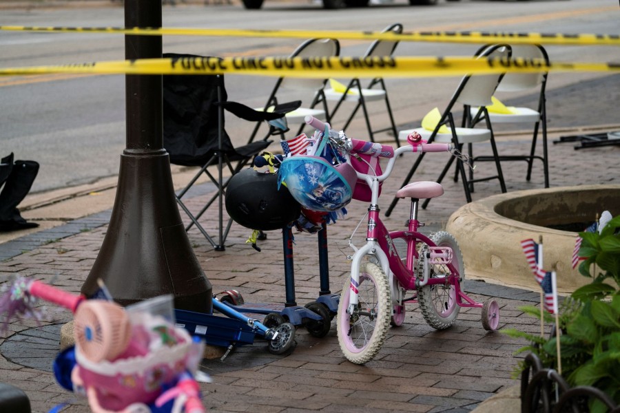 A child's bike is left behind after a mass shooting at a Fourth of July parade route in the wealthy Chicago suburb of Highland Park, Illinois, US July 4, 2022. REUTERS/Max Herman