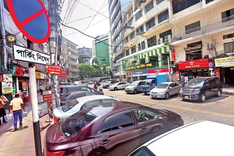 Many cars are parked illegally on a key road at Gulshan 2 in the city on Tuesday despite the no-parking sign being displayed prominently — FE photo Many cars are seen parked illegally on a key road at Gulshan 2 in the city despite the no-parking sign being displayed prominently — FE/Files