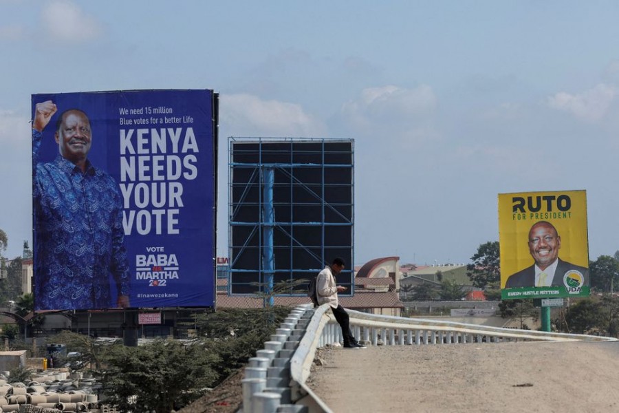 Banners of Kenya's opposition leader and presidential candidate Raila Odinga of the Azimio la Umoja (Declaration of Unity) coalition(R), and Kenya's Deputy President William Ruto and presidential candidate for the United Democratic Alliance (UDA) and Kenya Kwanza political coalition, are seen at the road side in Nairobi, Kenya, July 25, 2022. REUTERS/Baz Ratner