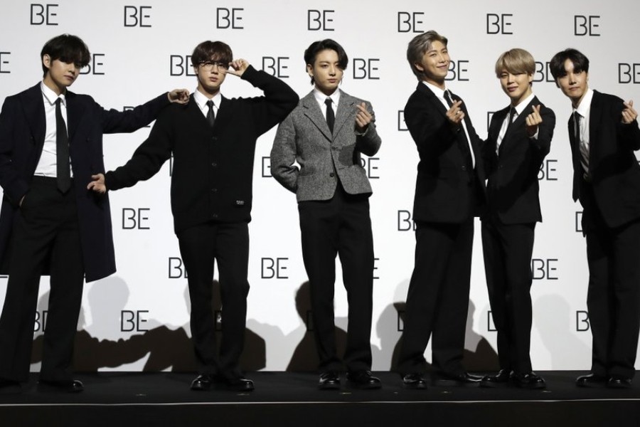 File photo taken Nov.20, 2020 members of South Korean K-pop band BTS pose for photographers during a press conference to introduce their new album "BE" in Seoul, South Korea. (AP Photo/Lee Jin-Man, file)
