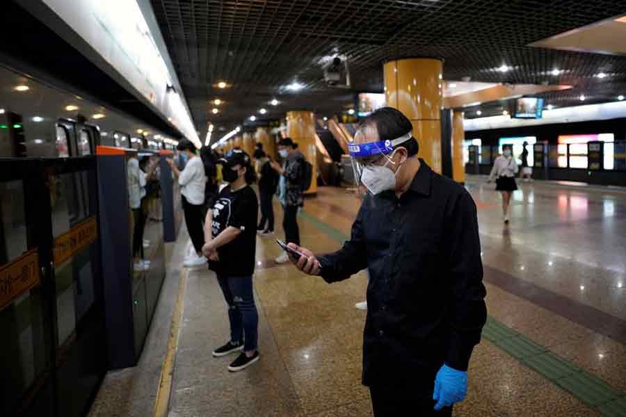A man checking his mobile phone at a subway station in Shanghai of China on June 2 this year after the end of a lockdown placed to curb the coronavirus disease (COVID-19) outbreak –Reuters file photo