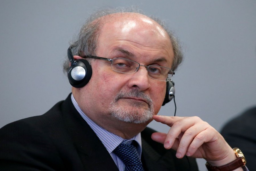 Author Salman Rushdie listens during the opening news conference of the Frankfurt book fair, Germany October 13, 2015. REUTERS/Ralph Orlowski/File Photo