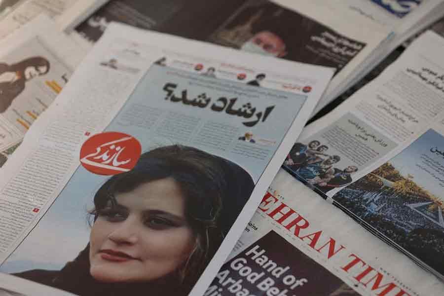A newspaper with a cover picture of Mahsa Amini, a woman who died after being arrested by Iranian police, is seen in Tehran on September 18 this year –Reuters file photo
