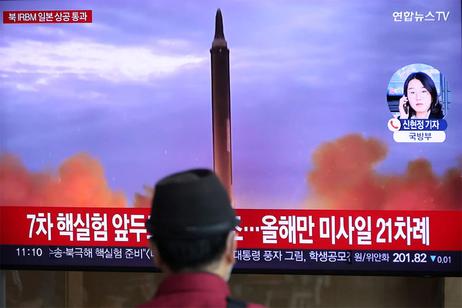 A man watches a TV broadcasting a news report on North Korea firing a ballistic missile over Japan, at a railway station in Seoul, South Korea on October 4, 2022 — Reuters photo