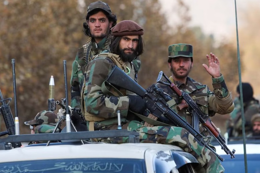 Members of Taliban sit on a military vehicle during Taliban military parade in Kabul, Afghanistan, Nov 14, 2021. REUTERS