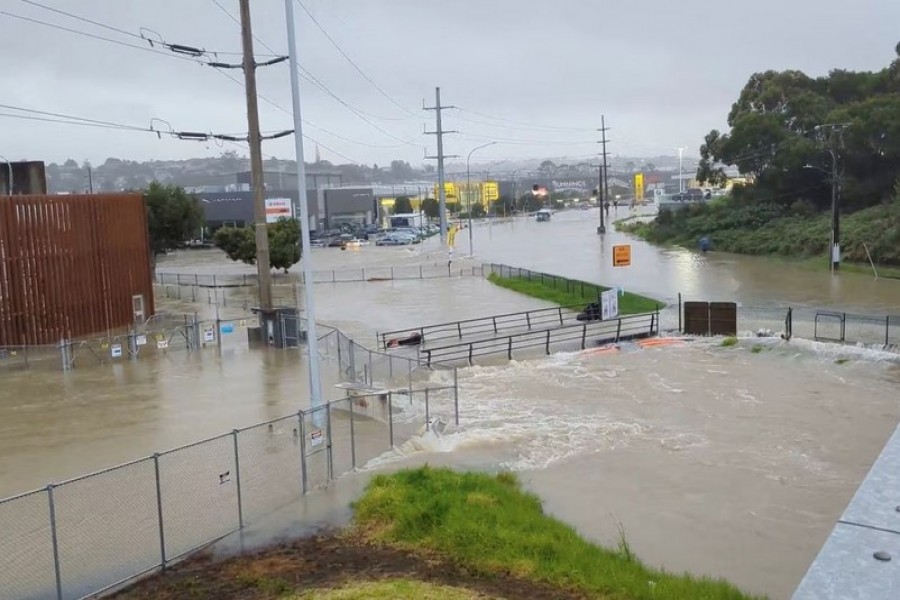 An area flooded during heavy rainfall is seen in Auckland, New Zealand January 27, 2023, in this screen grab obtained from a social media video. @MonteChristoNZ/via REUTERS