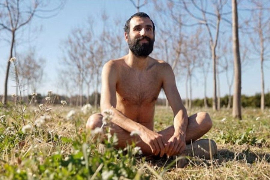 Alejandro Colomar poses naked in his vegetable garden, as Spanish court has ruled in favour of allowing him to continue walking around his village naked, as he has been doing since 2020, in Aldaia, near Valencia, Spain, February 3, 2023.REUTERS