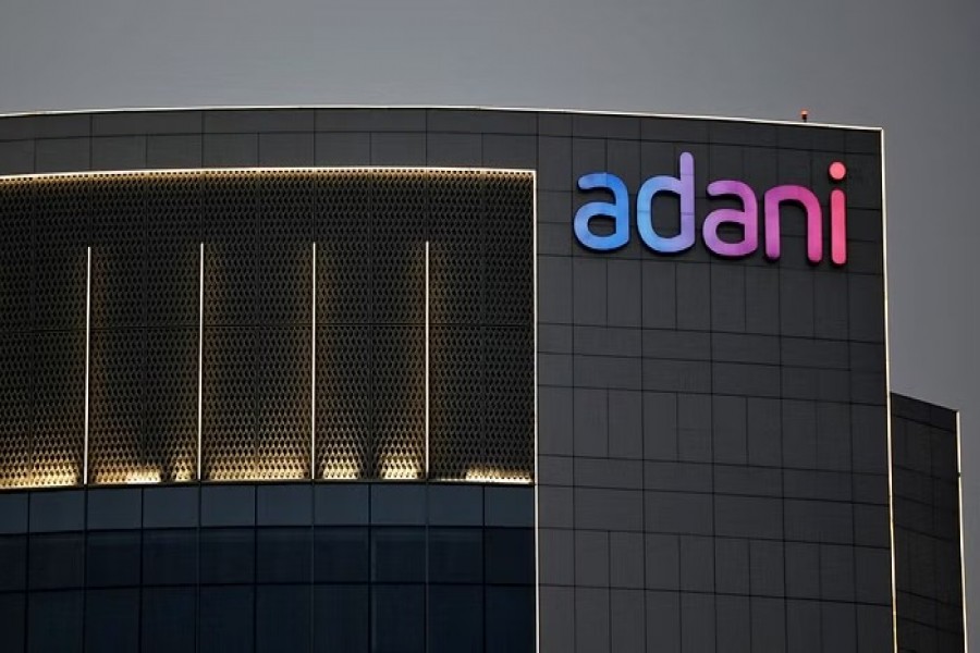 The logo of the Adani Group is seen on the facade of one of its buildings on the outskirts of Ahmedabad, India, April 13, 2021. REUTERS