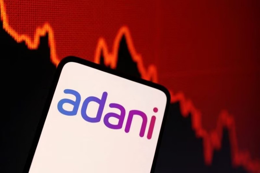 Adani logo and decreasing stock graph is seen in this illustration taken on January 31, 2023 — Reuters/Files